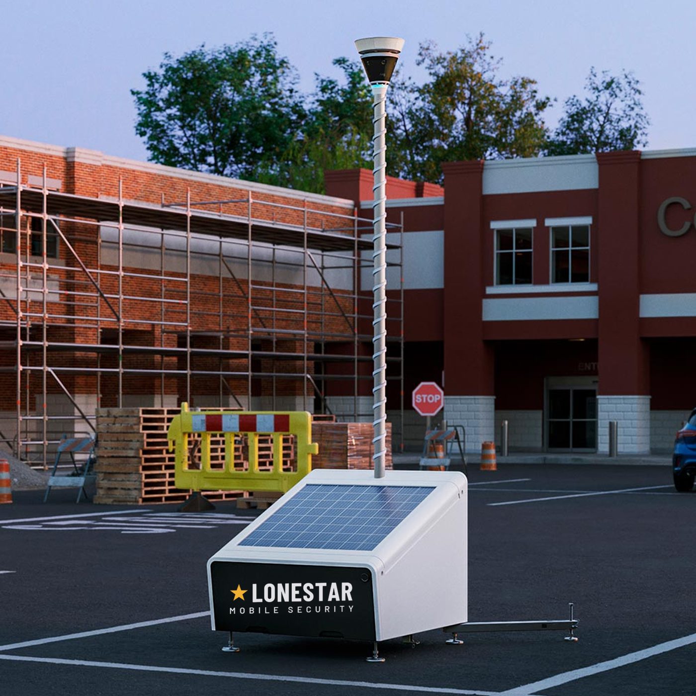 Lonestar Mobile Security solar-powered trailer deployed in a parking lot next to a construction site